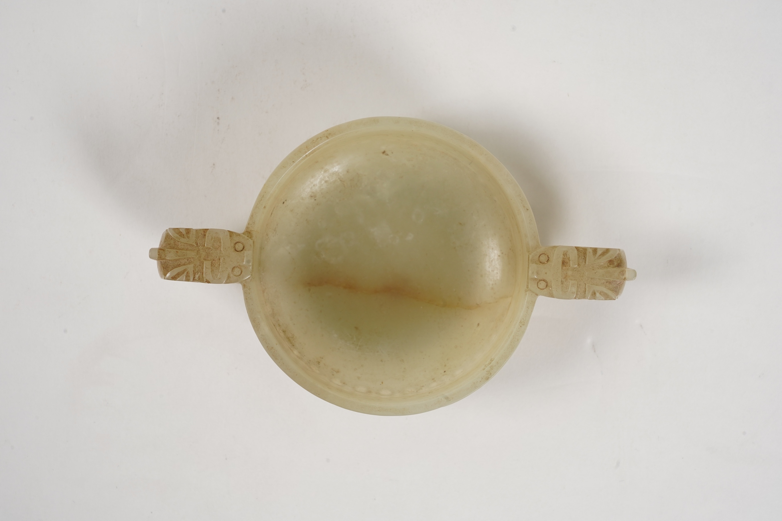 A Chinese pale celadon and russet veined jade cup, 17th century